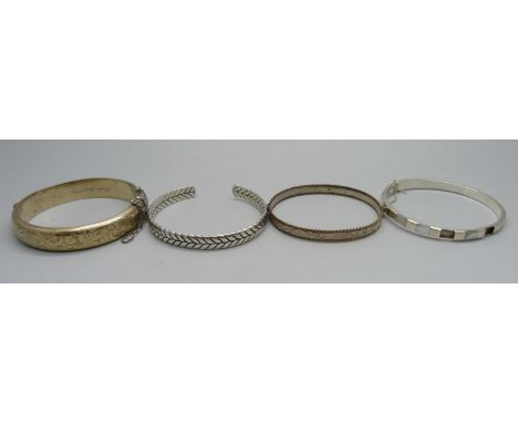 Four silver bangles, one lacking mother of pearl, 63g 