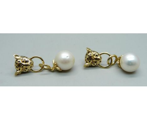 A pair of silver gilt and pearl panther earrings 