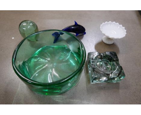 A Victorian green glass dump, large heavy green glass bowl, heavy glass ashtray, glass dolphin and white glass comport **PLEA