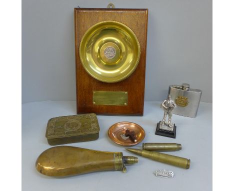 Military items; a 1914 Christmas tin, a mounted shell case base, shot flask, etc. 