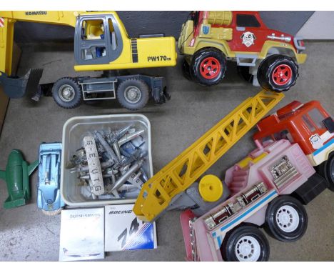 A collection of model vehicles including a Dinky Thunderbird 2, SPV, model aircraft, a Korean made fire ladder, a Matchbox fi