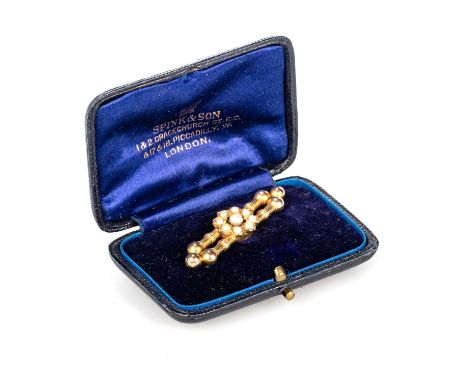 A LATE 19TH CENTURY SEED PEARL BROOCH a flowerhead cluster set with seed pearls, to a double bar with ball terminals. Unmarke