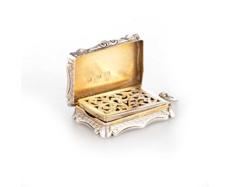 A VICTORIAN SILVER VINAIGRETTE by Alfred Taylor, Birmingham 1855, shaped rectangular form, with engine-turned decoration to a