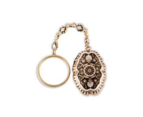A 19TH CENTURY ENAMEL VINAIGRETTE ON CHAIN AND RING yellow metal, shaped oval form, the cover decorated with black and white 
