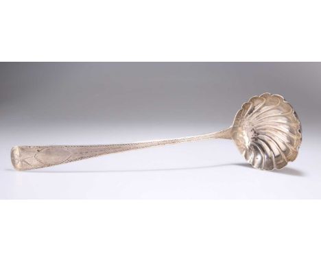 A GEORGE III IRISH SILVER SOUP LADLE maker J.S, Dublin 1803, Old English pattern, with bright-cut decoration and shell bowl. 