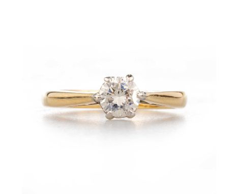 AN 18 CARAT GOLD SOLITAIRE DIAMOND RING a round brilliant-cut diamond in a claw setting. Estimated diamond weight 0.55ct, hal