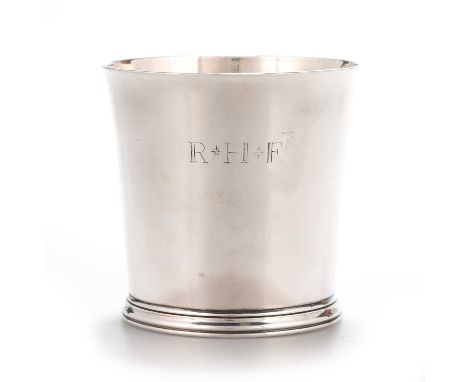 A QUEEN ANNE SILVER BEAKER by John East, London 1704, of tapering cylindrical form with moulded foot rim, engraved R*H*F, pap