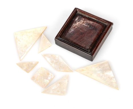 A TREEN PUZZLE BOX, 19TH CENTURY square, containing seven assorted shaped mother-of-pearl puzzle pieces carved with Oriental 
