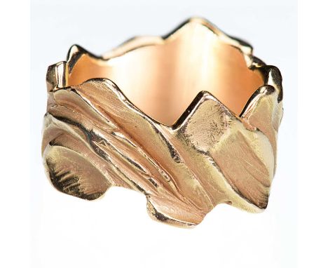 AN ABSTRACT BAND RING of heavily textured naturalistic form. Signed 'Paradiesli 2000', marked 'Gold 18K', size O1/2, 15.9 gra