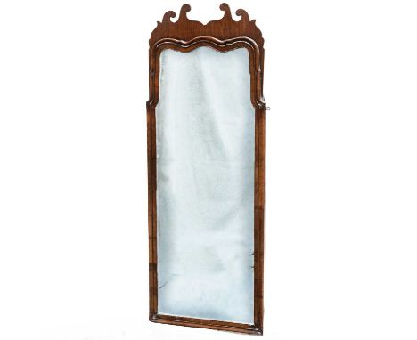A QUEEN ANNE STYLE WALNUT MIRROR, EARLY 20TH CENTURY the tall plate within a cushion-moulded surround, with shaped cresting. 