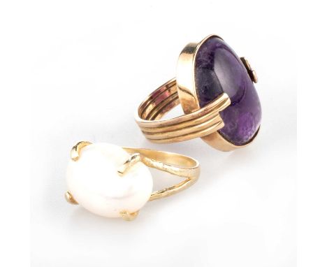 TWO DRESS RINGS comprising AN AMETHYST CABOCHON RING, unmarked, ring size I1/2, 9.1 grams; and A CULTURED PEARL RING, marked 