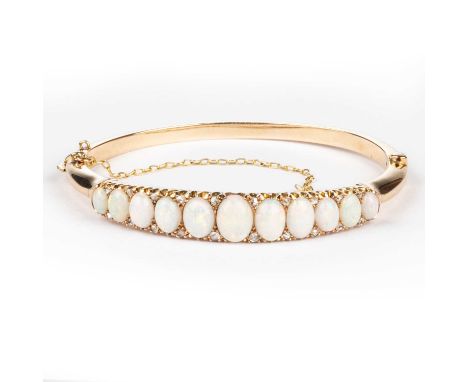 A LATE 19TH CENTURY OPAL AND DIAMOND HINGE OPENING BANGLE graduated oval opals spaced by rose-cut diamonds, to a plain hinge 