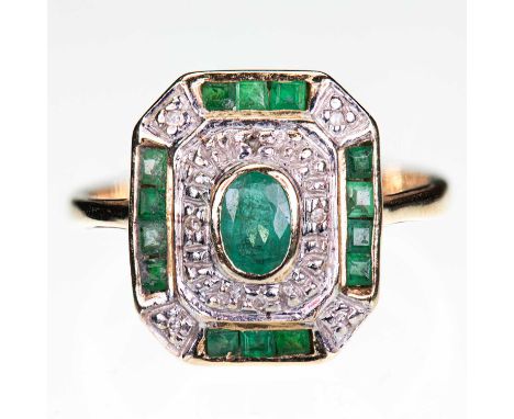 A 14 CARAT GOLD EMERALD AND DIAMOND CLUSTER RING an oval-cut emerald within an octagonal border of emeralds and eight-cut dia