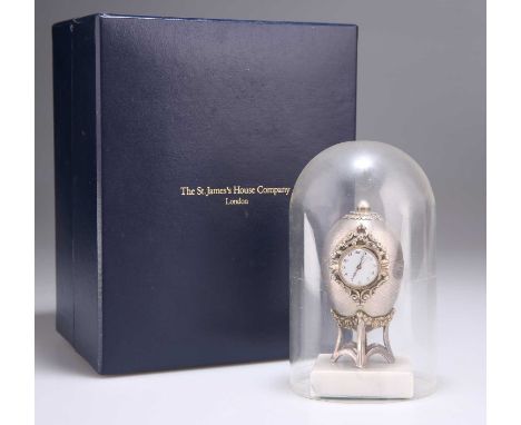 AN ELIZABETH II SILVER EASTER EGG CLOCK by St James House Company, London 1983, the small round clock with a white dial, Arab