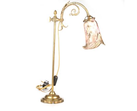 A LATE VICTORIAN BRASS ADJUSTABLE READING LAMP formerly a gasolier lamp, with marbled glass shade. 54cm high (overall)