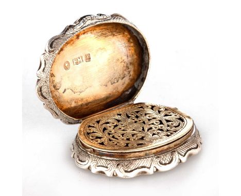 A RARE VICTORIAN SILVER VINAIGRETTE by Frederick Marson, Birmingham 1846, shaped oval form, the hinged lid engraved with a Co
