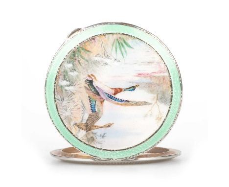 A GEORGE V SILVER AND ENAMEL COMPACT by Henry Clifford Davis, Birmingham 1937, painted depicting mallards in flight in a rive