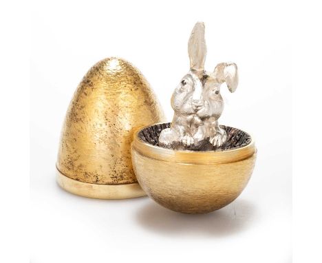 STUART DEVLIN: AN ELIZABETH II SILVER-GILT SURPRISE EGG by Stuart Devlin, London 1973, opening to reveal a rabbit, no. 74, bo