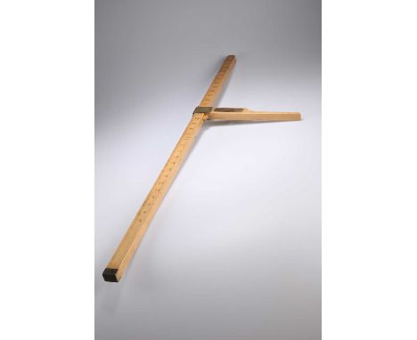 A HOUND MEASURING STICK by Swaine &amp; Adeney Ltd, London, marked with a scale of 36 inches, wooden with brass mounts, the s