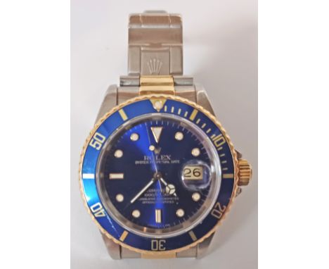 A Rolex Submariner Bi-metal Blue dial reference 16613 watch, complete. Model: 16613 Serial: X968775 Year: 1991 Case Material: