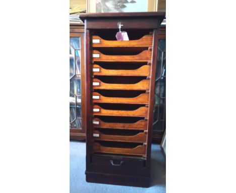 AN EARLY 20th CENTURY OAK TAMBOUR FILING CABINET FROM COOKE'S (FINBURY) WITH 9 SLIDING SHELVES &amp; KEY. 
&nbsp;
114cm HIGH,