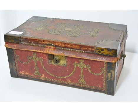 A brass-studded leather strong box in 17th century style, late 19th century, in (distressed) red leather decorated to the cov