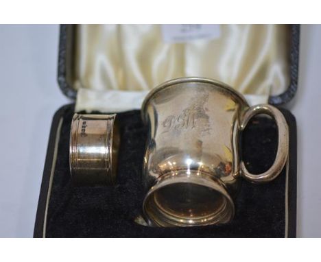 A George VI cased christening set of mug and napkin ring (lacking spoon), Sheffield 1938 and 1939, the mug of baluster form. 