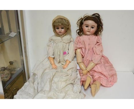 Two large German bisque head dolls, c. 1900, one Max Handwerck no. 283/31s, each with sleeping eyes and composition body. Fir