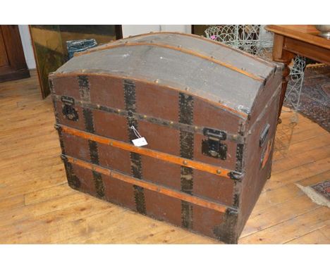 A large 19th century dome top travelling trunk, with studded wooden bands, the interior fitted with a lift-out tray. 82cm by 