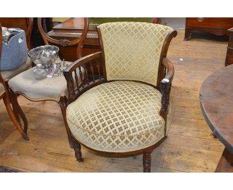 An early Victorian rosewood open armchair, the scroll back above a shaped circular stuffed over seat, encircled by delicate b