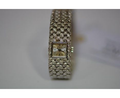 A lady's vintage 18ct white gold wristwatch, by Zenith,  the square silvered dial with baton numerals, on an 18ct plaited wea