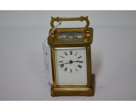 A French brass-cased carriage clock, Richard & Co,. Paris, the white enamel dial with Roman numerals, movement stamped with m
