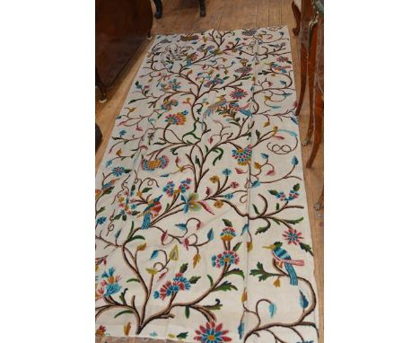 A pair of crewel work curtains, worked  with birds amidst flowering boughs in coloured wools against a cream linen ground, li