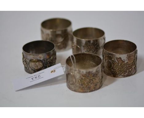 A set of four Chinese Export napkin rings, each decorated in relief with flowering boughs, marked CS (Cumshing, Shanghai?); t