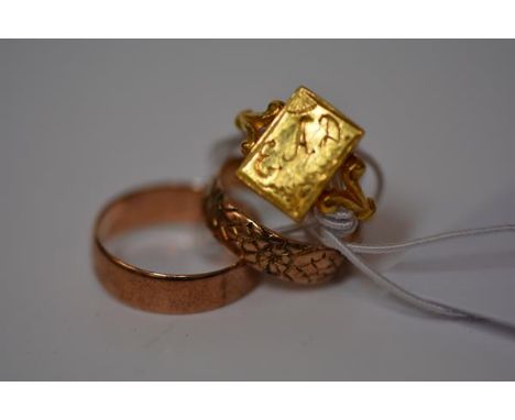 Two 9ct gold wedding bands; together with an Indian yellow metal ring (unmarked). Total 8.6 grams