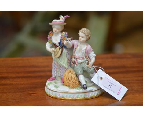 A Meissen figure group, late 19th century, emblematic of Autumn, of a boy and girl, she playing a lute, he seated on a sheaf 