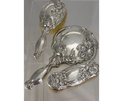 A Solid Silver Art Nouveau Lady's Dressing Table Set, comprising clothes brush, hair brush and mirror, Birmingham hallmark dd