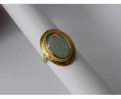 A Lady's 14 Ct Yellow Gold and Opal Ring, opal triplet 13.5 x 9.5 mm, size K, approx 3.4 gms.