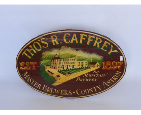 An Oval Timber Advertising Sign for Thos R Caffrey, Master Brewers, County Antrim, approx 92 x 60 cms.