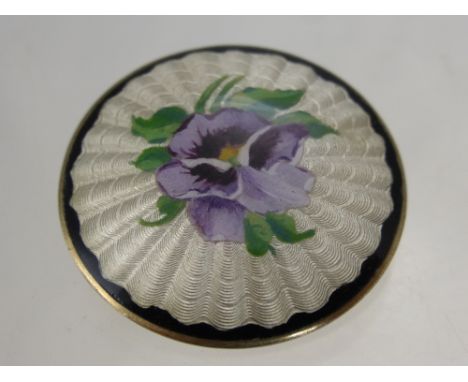 A Vintage Disc Form Continental solid silver and enamel brooch depicting a pansy, the brooch having a gilded back.