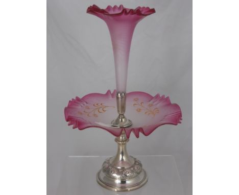 An Edwardian Opaque Cranberry Glass and Continental Silver Epergne, with gilt highlights. The pleated single flute held withi