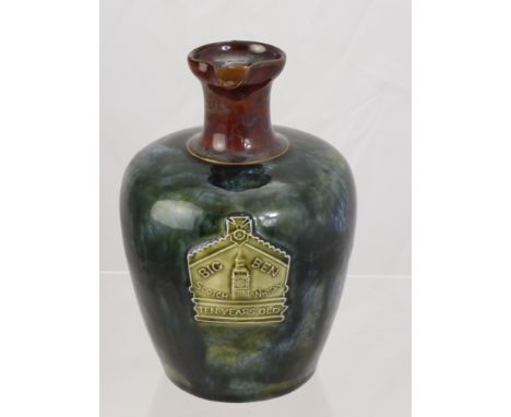 Royal Doulton Art Ware Whisky Decanter, the decanter with green & blue mottled glaze, brown neck & handle. Raised plaque to f