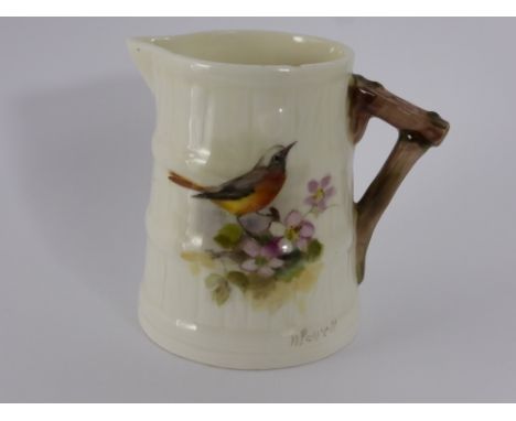 A Royal Worcester Hand Painted Miniature Jug, depicting a wild rose and signed N. Powell.