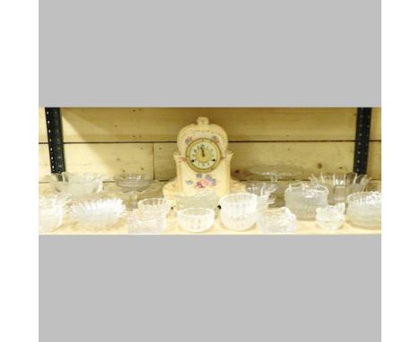 A shelf of glass, to include Dartington crystal and a Victorian mantel clock