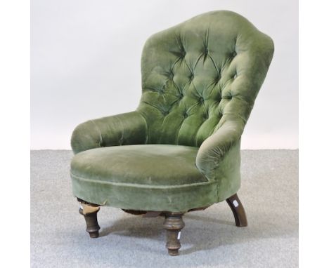 A Victorian green upholstered button back armchair