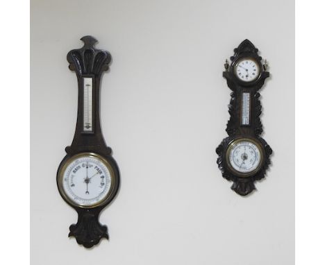 An early 20th century oak cased aneroid barometer/clock, 63cm high, together with another barometer