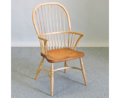 A light yew wood Windsor style armchair, with a crinoline stretcher