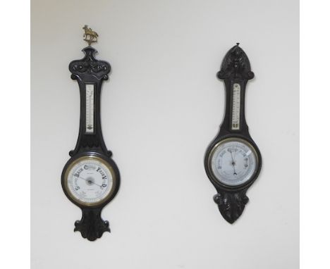 An early 20th century oak cased aneroid barometer, 95cm high, together with another smaller