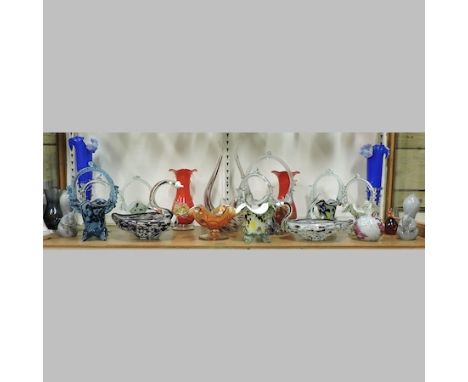 A shelf of coloured glass, to include vases and Murano baskets, tallest 31cm