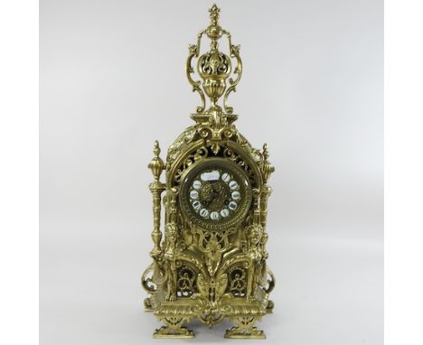 An ornate 19th century French brass cased mantel clock, 58cm high